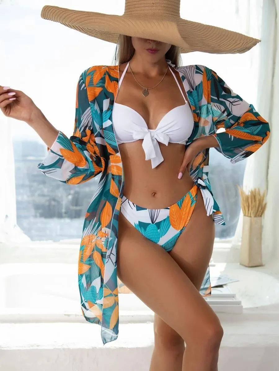 Women's three-piece bikini swimsuit set with mesh split design showing top, pants, and coat