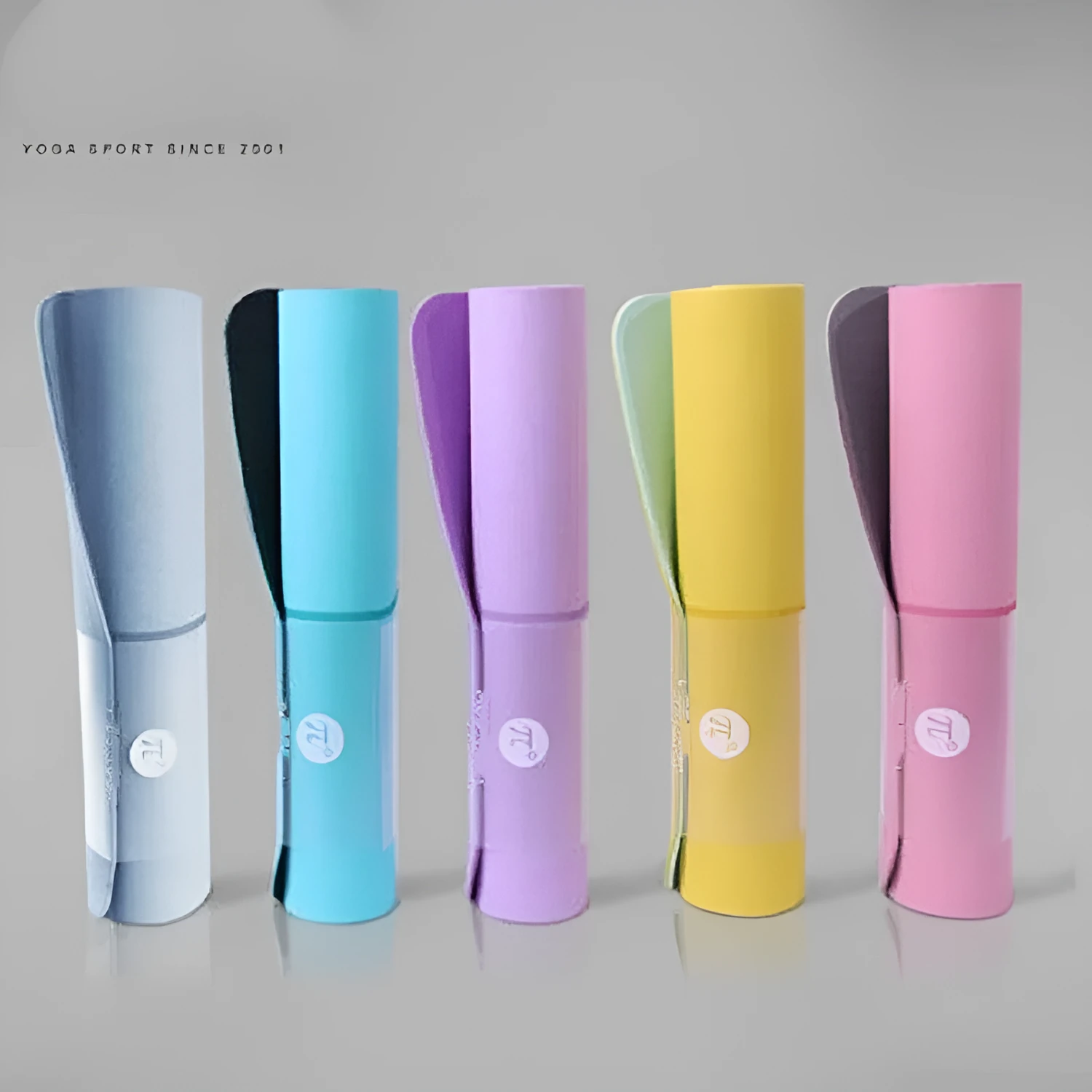 Paido TPE yoga mat rolled out in pink and grey colour on a clean floor
