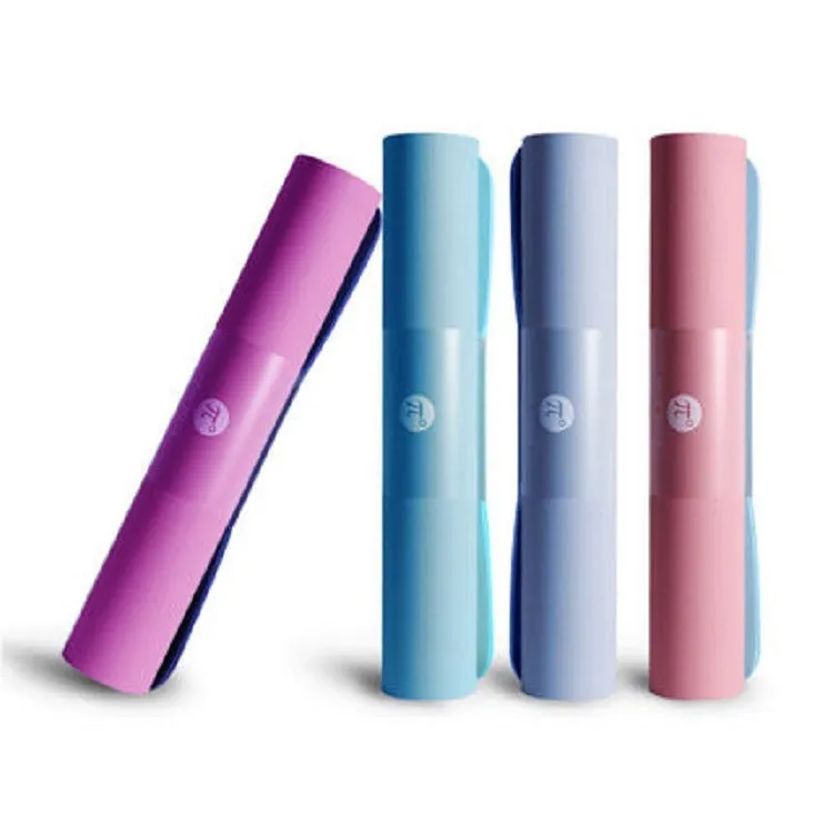 Paido TPE yoga mat rolled out in pink and grey colour on a clean floor