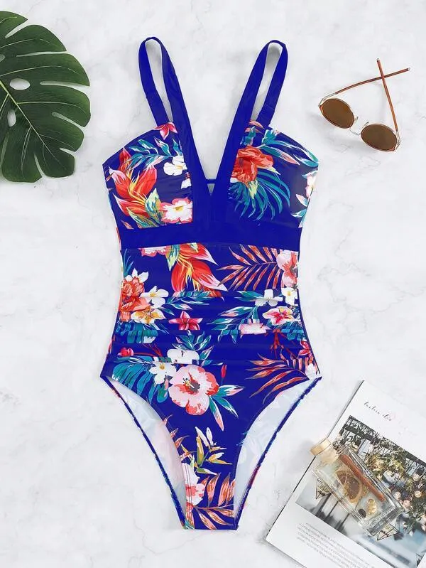 Women's floral pattern one-piece swimsuit with a backless design on a mannequin