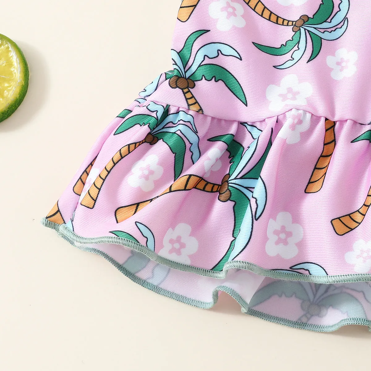White children's two-piece swimsuit set with shirt and shorts, suitable for ages 6 months to 3 years.