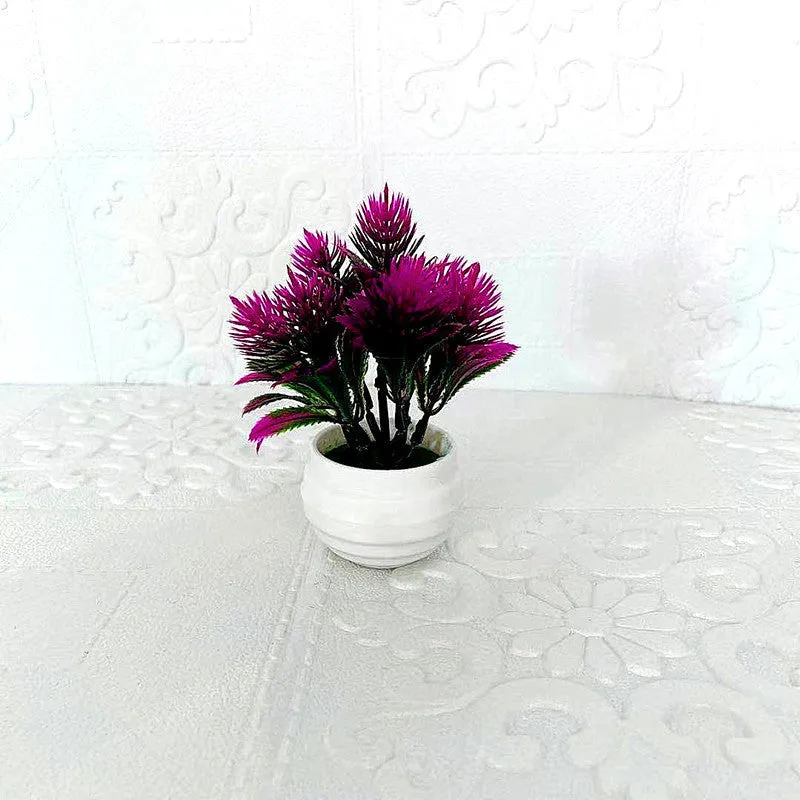 Simulated bonsai potting ornament in green plastic with bonsai shape on white background