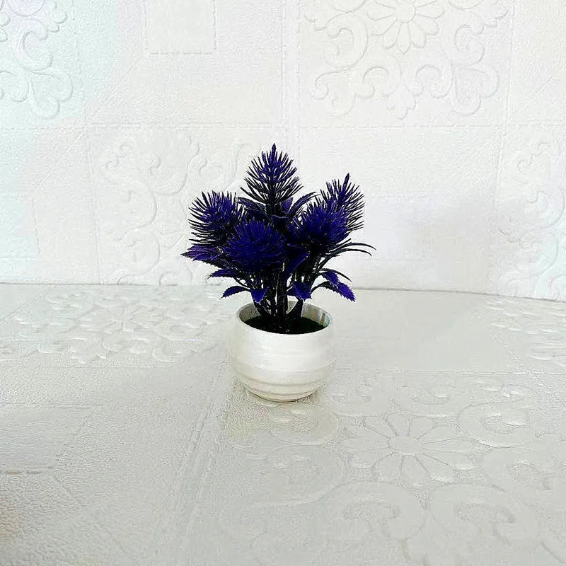Simulated bonsai potting ornament in green plastic with bonsai shape on white background