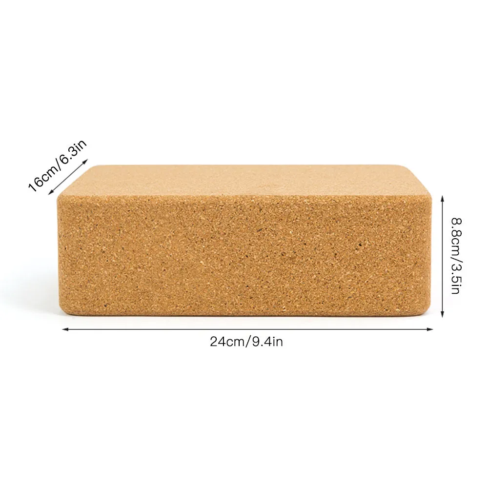 Yellow cork yoga brick with beveled edges and nonslip surface, size 24x16x8.5cm, on a plain background