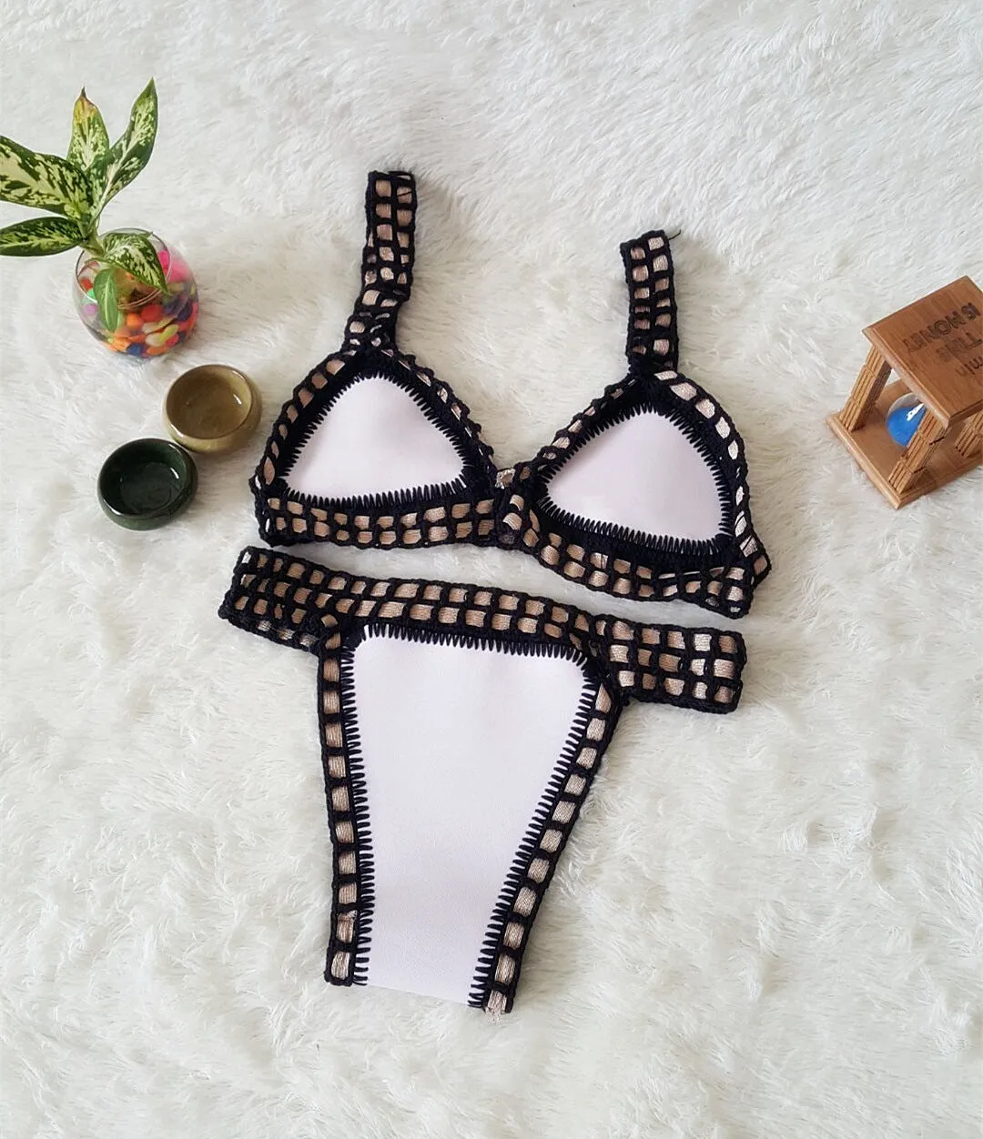 Hand crochet colourful bikini set with lace trim and rubber straps in multiple colours on white background