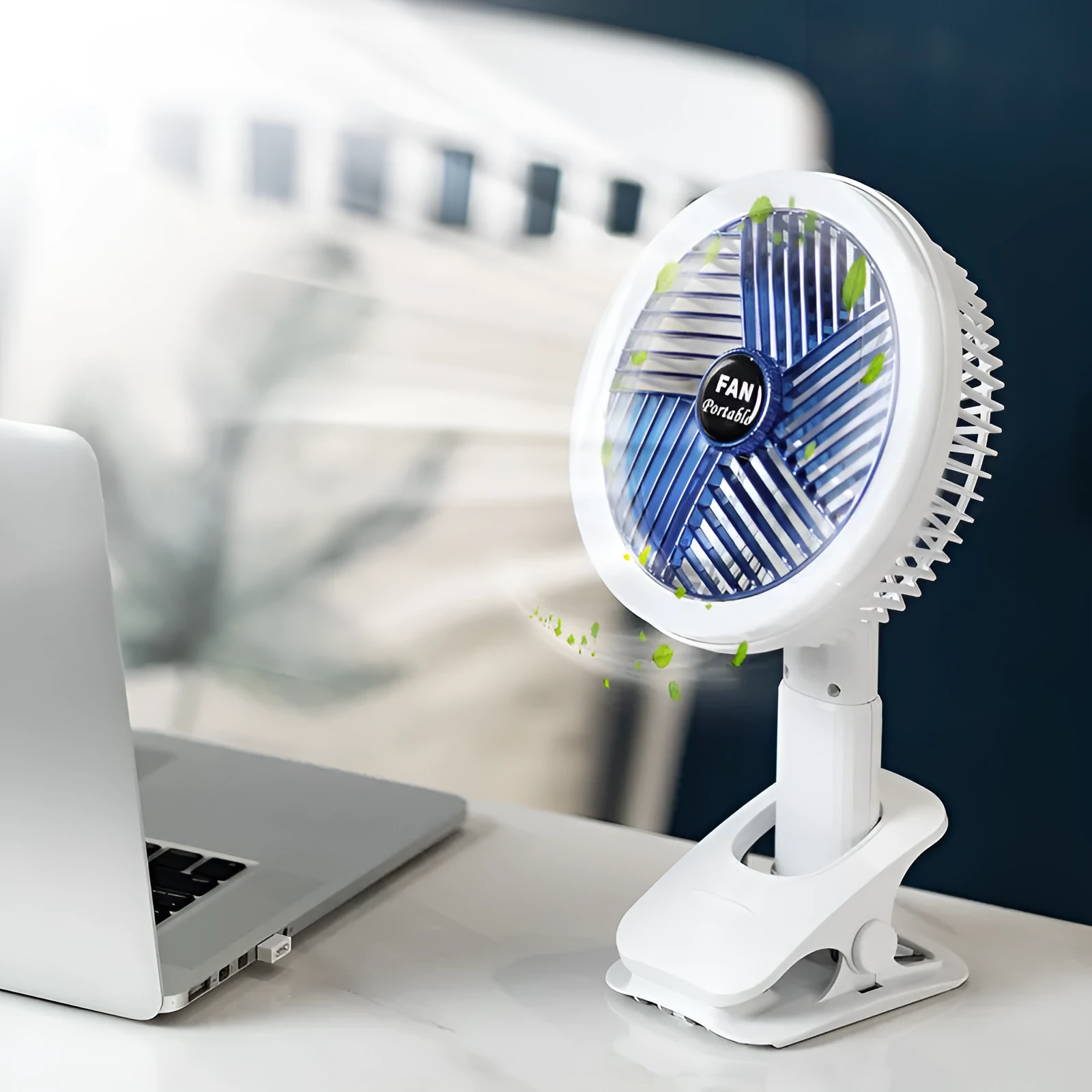 White and blue plastic rechargeable clip fan with USB cable, 29x18cm, clamped on a desk edge