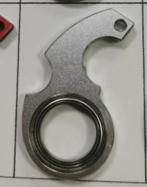 Metal texture rotating keychain in karambit style with key ring in black colour