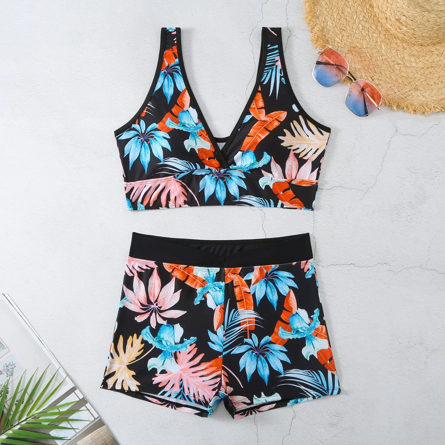 Two-piece female swimsuit set with printed boxer brief bottoms and sleeveless top