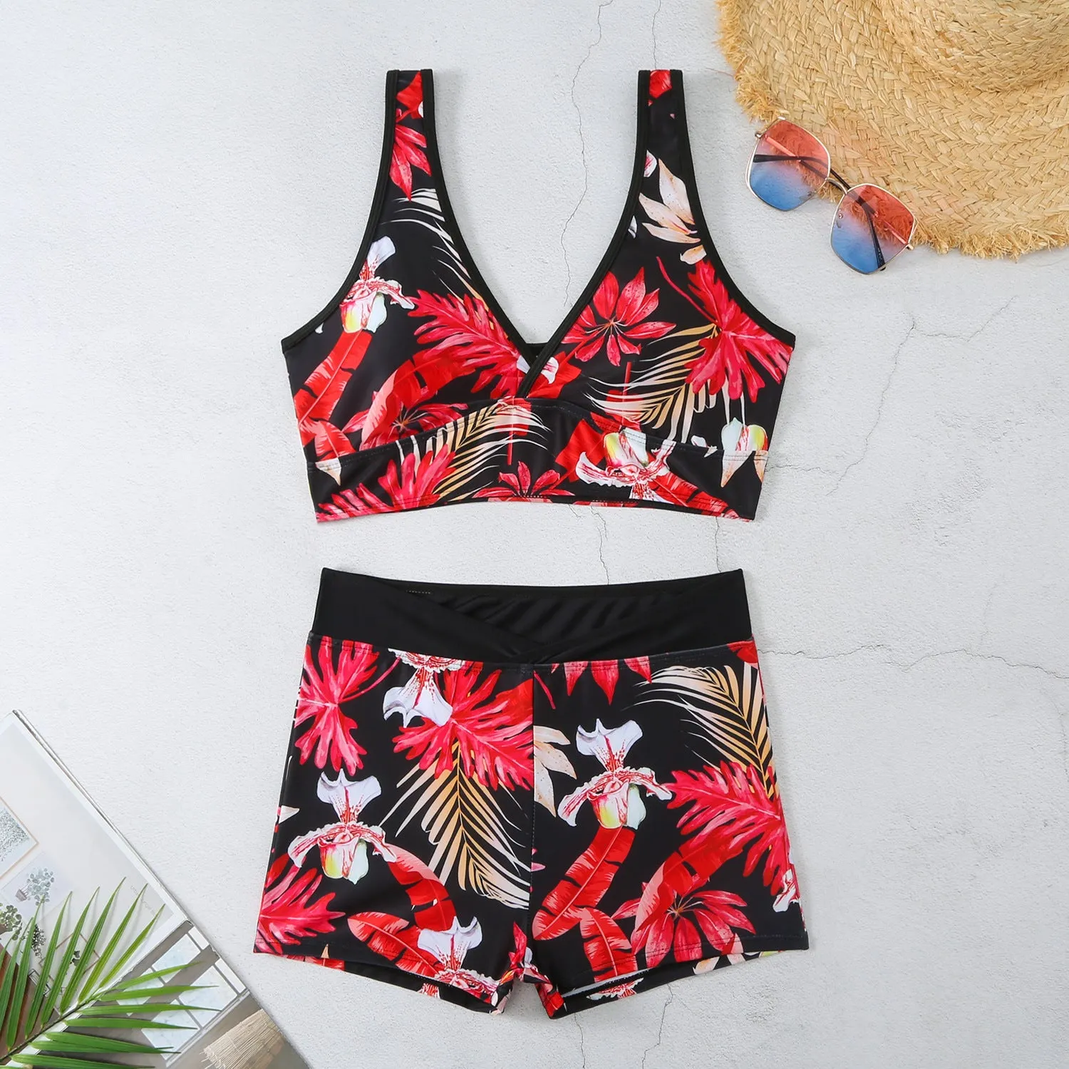 Two-piece female swimsuit set with printed boxer brief bottoms and sleeveless top