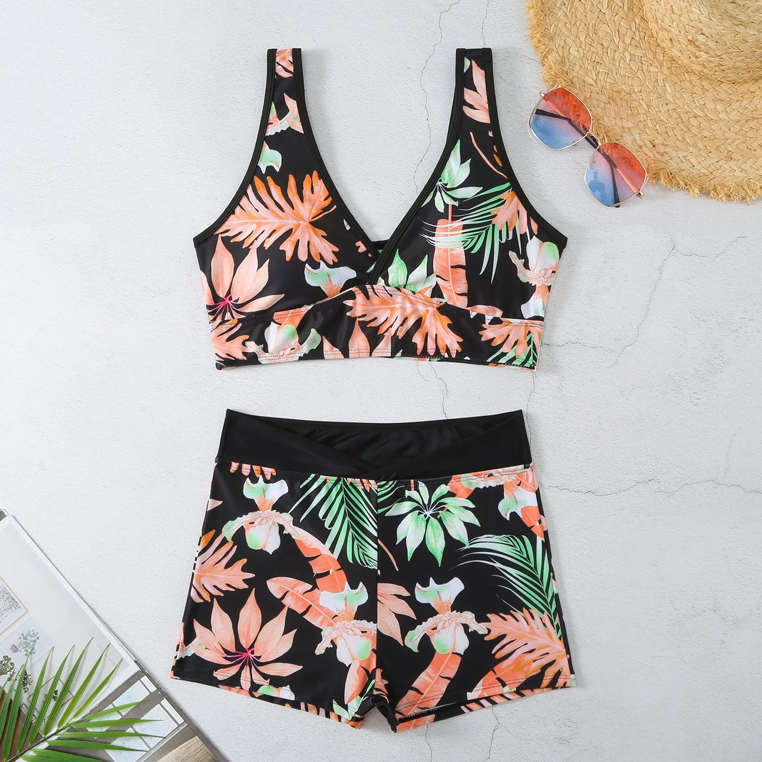 Two-piece female swimsuit set with printed boxer brief bottoms and sleeveless top
