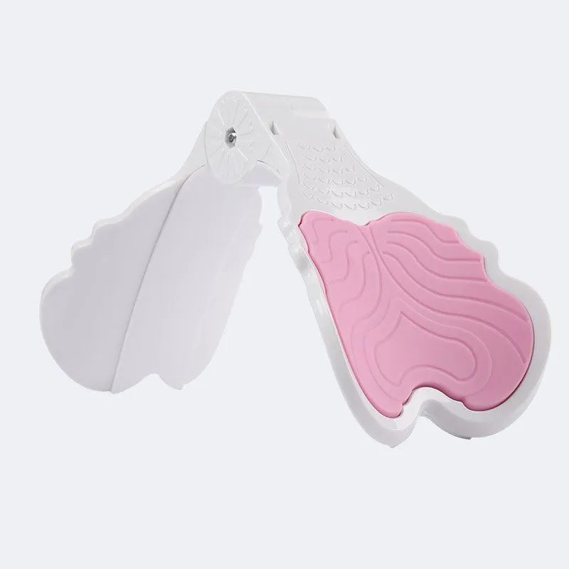 Pink hip trainer with silicone surface measuring 27cm by 9.5cm for pelvic floor and inner thigh exercises