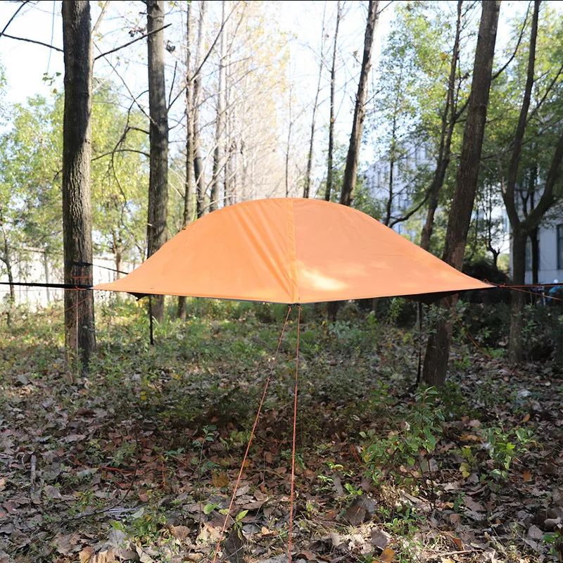 Self-driving tour camping hammock tent with aluminium pole and mosquito net suspended between trees in a forest setting