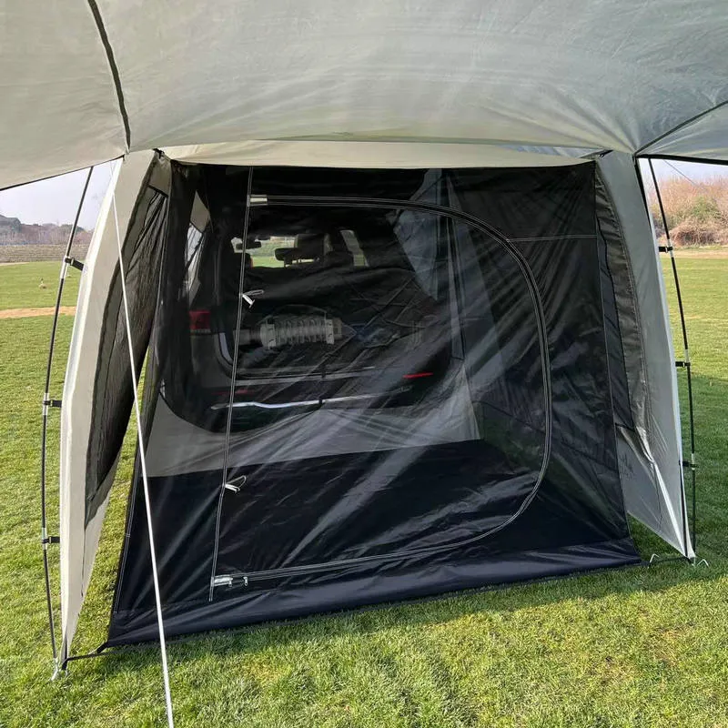 Car tail extension tent set up at a campsite with rear access, showing 190T silver-coated anti-UV fabric and screen windows.