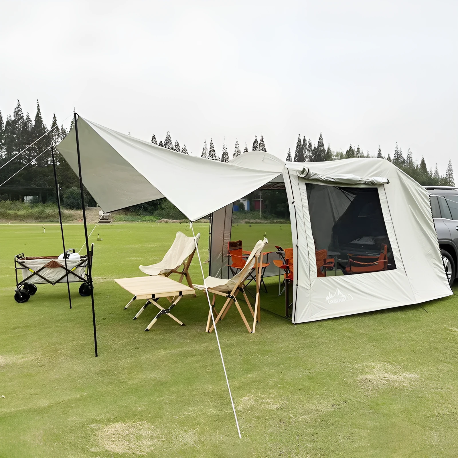 Car tail extension tent set up at a campsite with rear access, showing 190T silver-coated anti-UV fabric and screen windows.