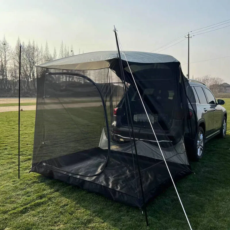 Car tail extension tent set up at a campsite with rear access, showing 190T silver-coated anti-UV fabric and screen windows.