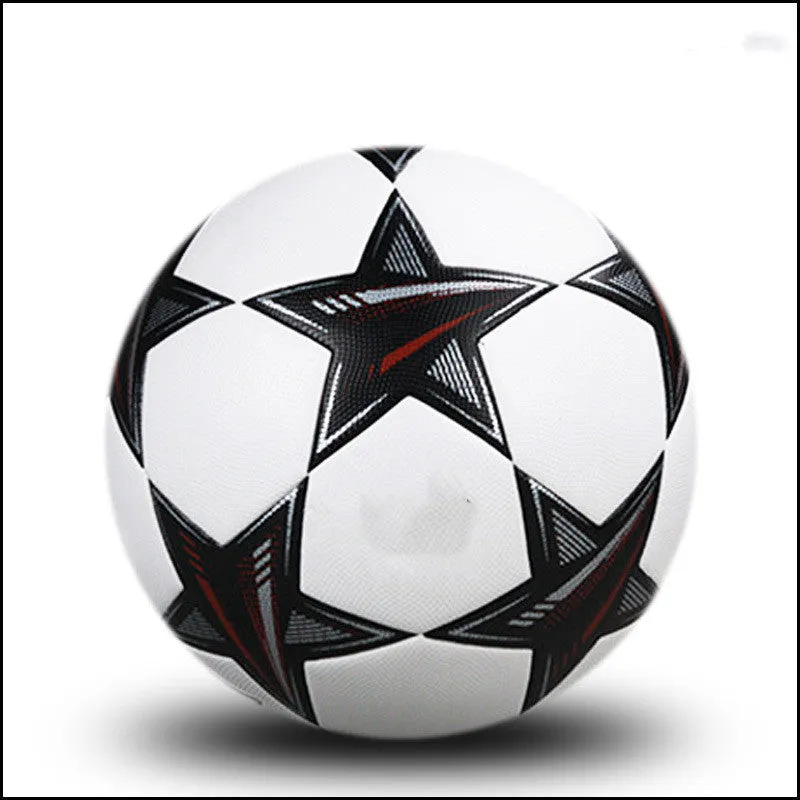 UEFA Champions League PU leather football in multi-colour design with white panels and red accents on grass