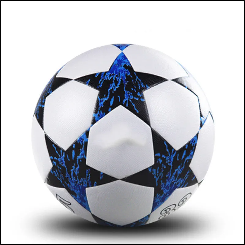 UEFA Champions League PU leather football in multi-colour design with white panels and red accents on grass
