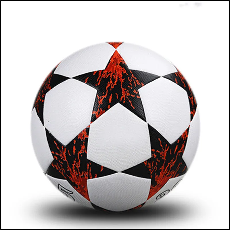 UEFA Champions League PU leather football in multi-colour design with white panels and red accents on grass