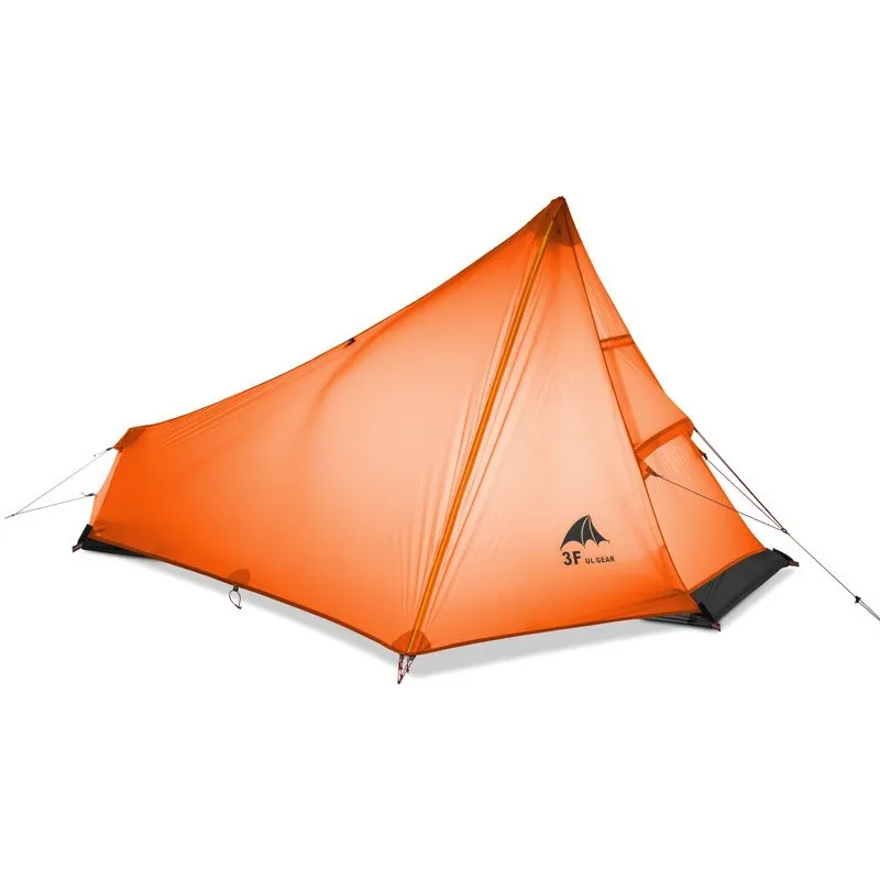 Silicon coated outdoor camping pyramid tent in green pitched on grass showing fly and aluminium pole