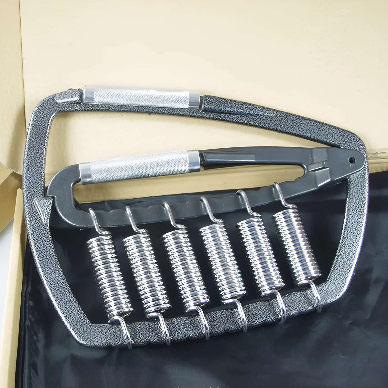 Metal grip set fitness exercise hand strengthener with upgrade 6 spring steel springs on neutral background