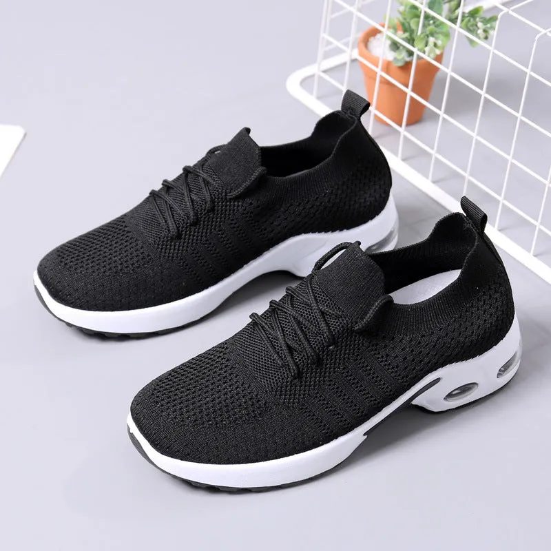 Women's solid-colour mesh sneaker with lace-up front and round toe, shown in grey.