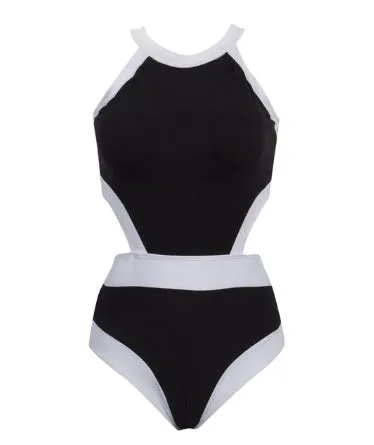 Women's one piece swimsuit in black and white patchwork design