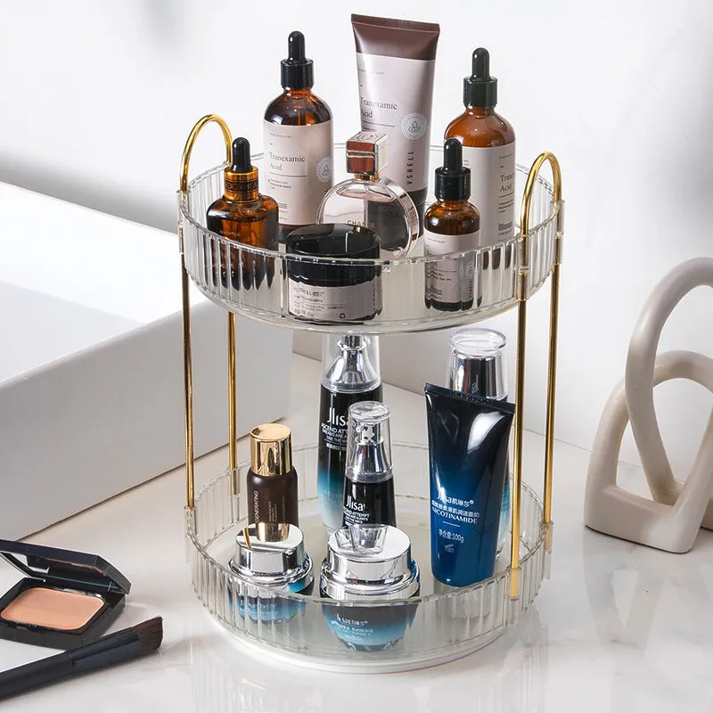 Three-layer rotating bathroom cosmetics storage rack in green, yellow, and white on a desktop