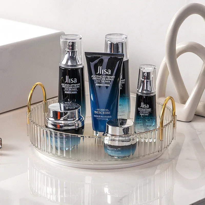 Three-layer rotating bathroom cosmetics storage rack in green, yellow, and white on a desktop