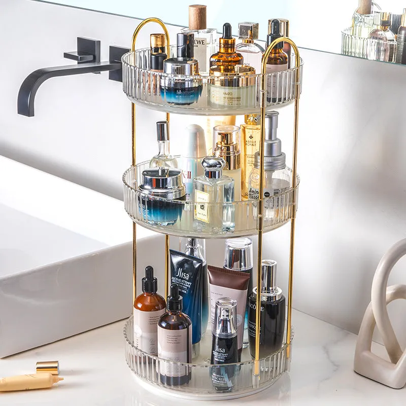 Three-layer rotating bathroom cosmetics storage rack in green, yellow, and white on a desktop