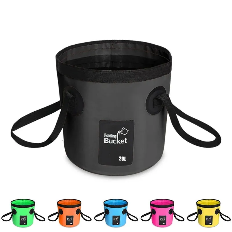 Yellow 20L folding PVC tarpaulin bucket open and standing on grass with water inside