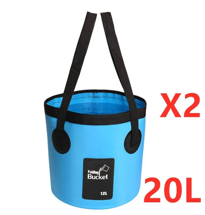 Yellow 20L folding PVC tarpaulin bucket open and standing on grass with water inside