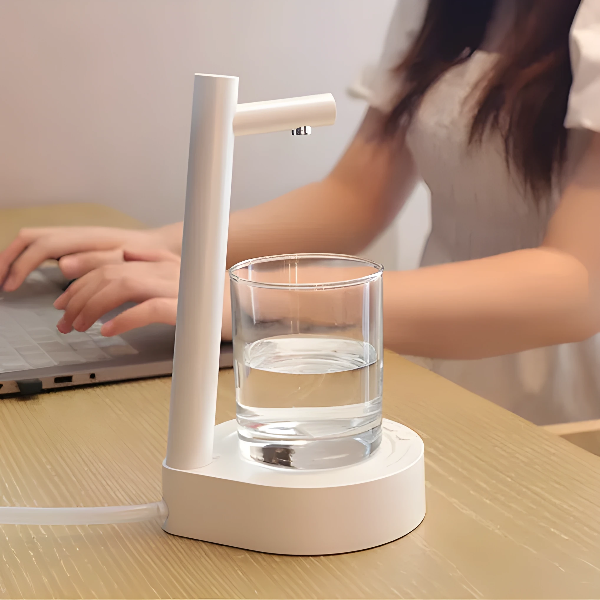 White desktop bottled water automatic pumping device with ABS shell and USB rechargeable battery on a bottle