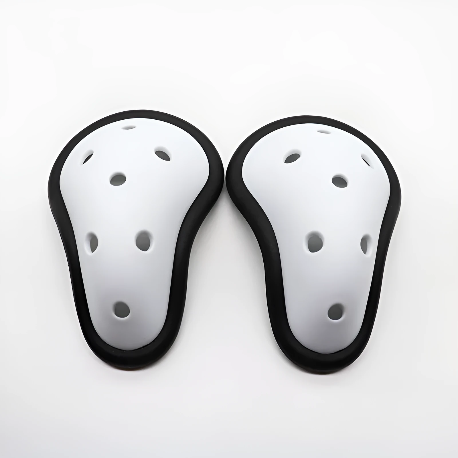 Rubber sports genital protector groin guard for adult and child sizes, used in boxing rugby hockey and martial arts.