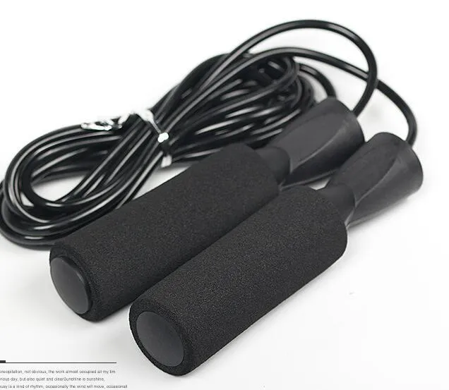 Adjustable Jump Fit Rope with black weighted handles and red speed rope on a dark workout mat