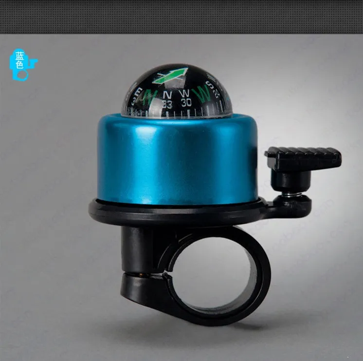 Bicycle compass bell in red mounted on handlebar with compass visible on ring