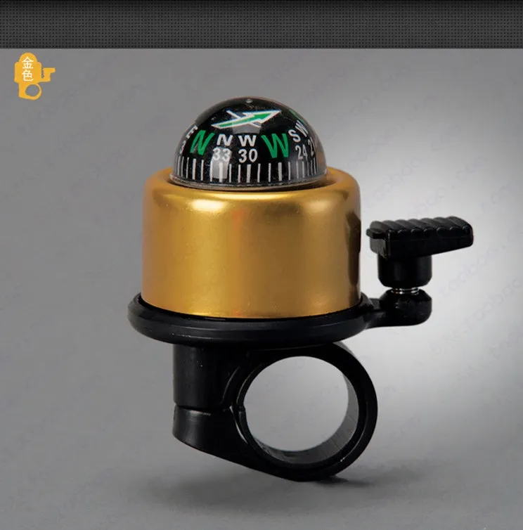 Bicycle compass bell in red mounted on handlebar with compass visible on ring