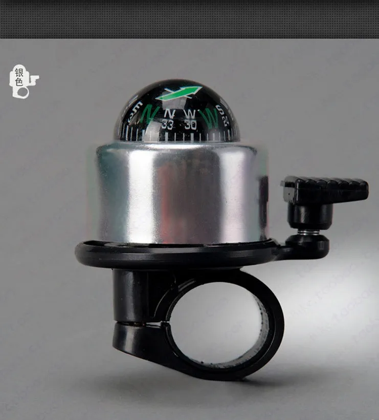 Bicycle compass bell in red mounted on handlebar with compass visible on ring