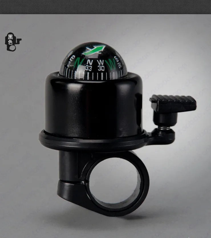 Bicycle compass bell in red mounted on handlebar with compass visible on ring