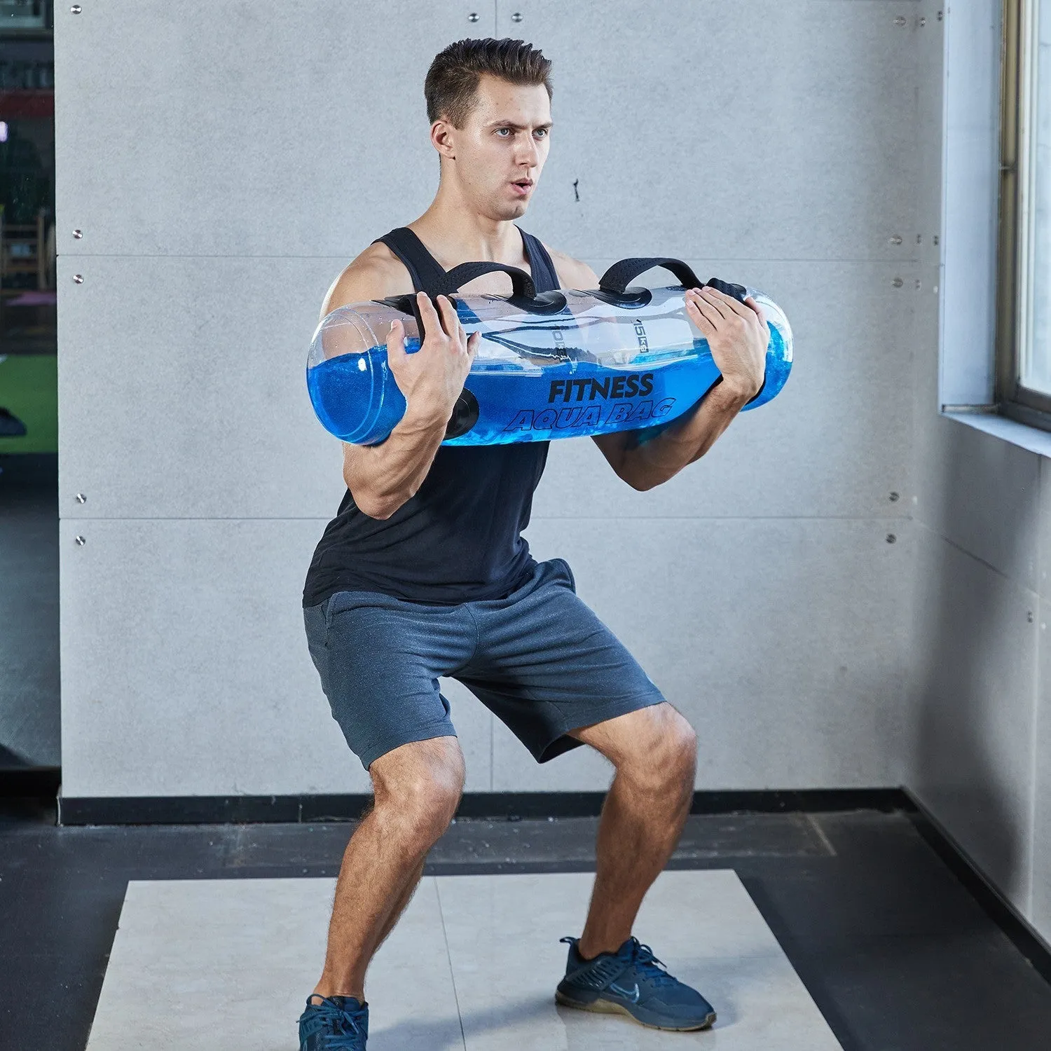 Clear PVC inflatable water bag for weight training, shown with water inside.
