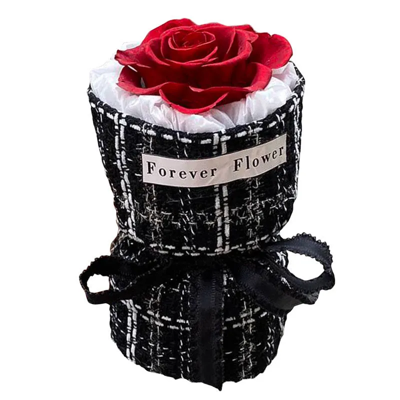 Dried flower eternal life bouquet in classic flowerpot style, red colour variant, on a tabletop