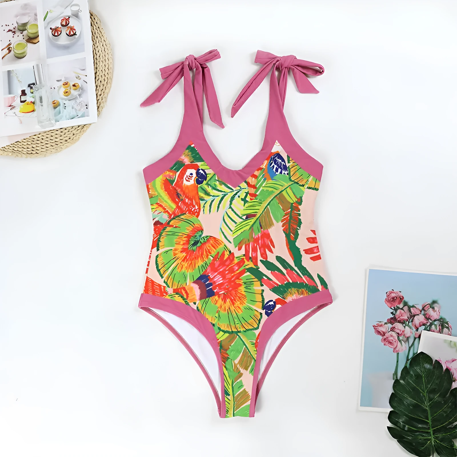 Retro pink floral print one-piece swimsuit with V-neck, thin skirt, and covered belly design.