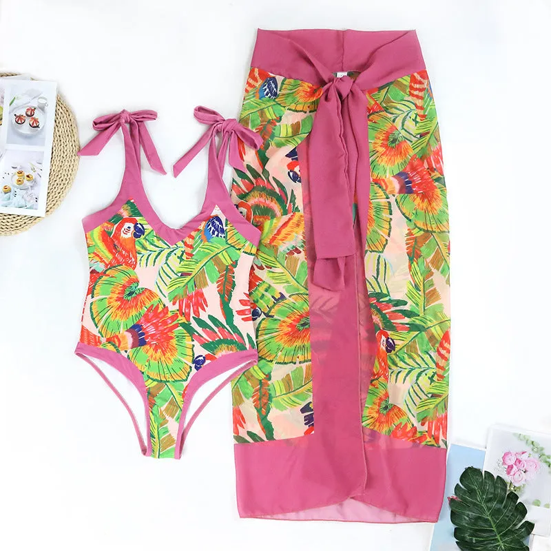 Retro pink floral print one-piece swimsuit with V-neck, thin skirt, and covered belly design.