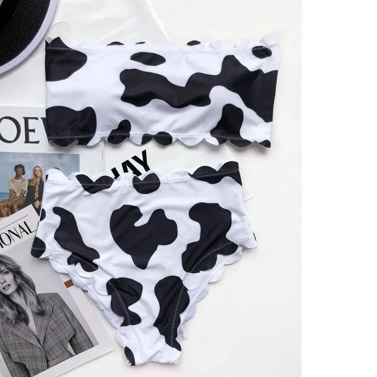 Black and white cow print wrapped breast bikini set on a model, nylon fabric, black and white animal pattern, adjustable wrap front top