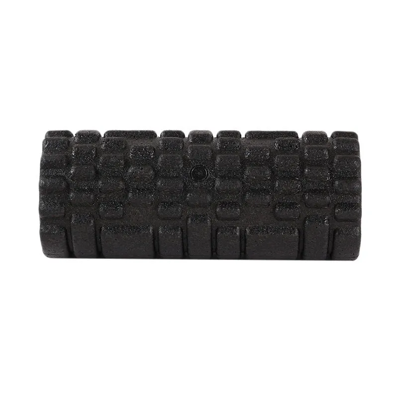 Hollow black EPP foam roller 33x14cm on flat surface for Pilates and balance exercises