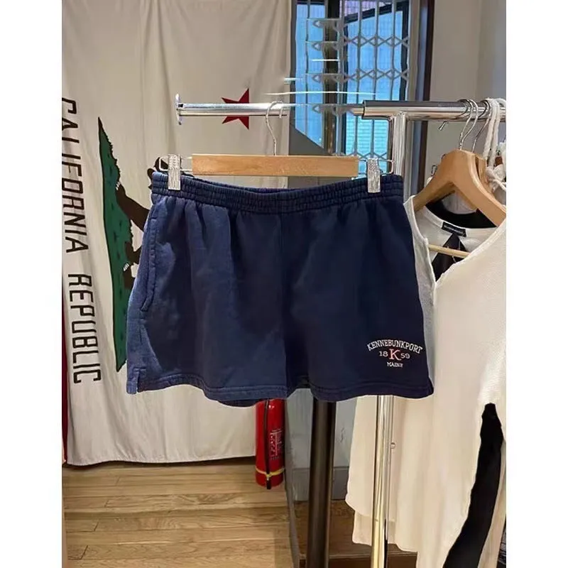Dark blue cotton high top sports shorts for women with white flag embroidery