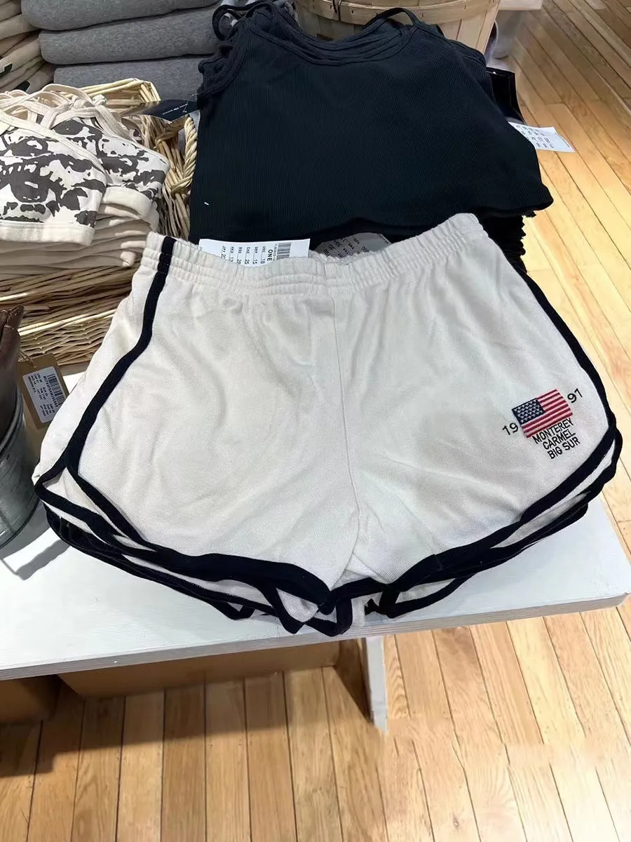 Dark blue cotton high top sports shorts for women with white flag embroidery