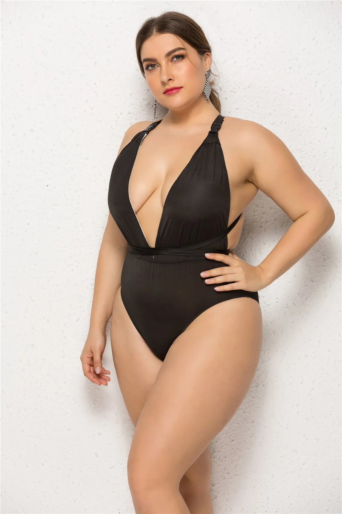 Plus size women's black one-piece backless swimsuit with high elasticity fabric and chest pads