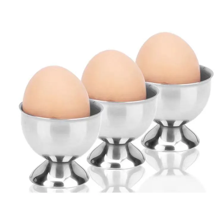 Creative stainless steel egg bracket in silver finish, holding eggs on a kitchen countertop.