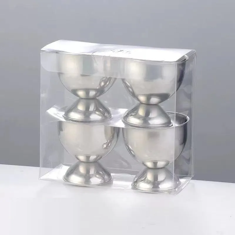Creative stainless steel egg bracket in silver finish, holding eggs on a kitchen countertop.