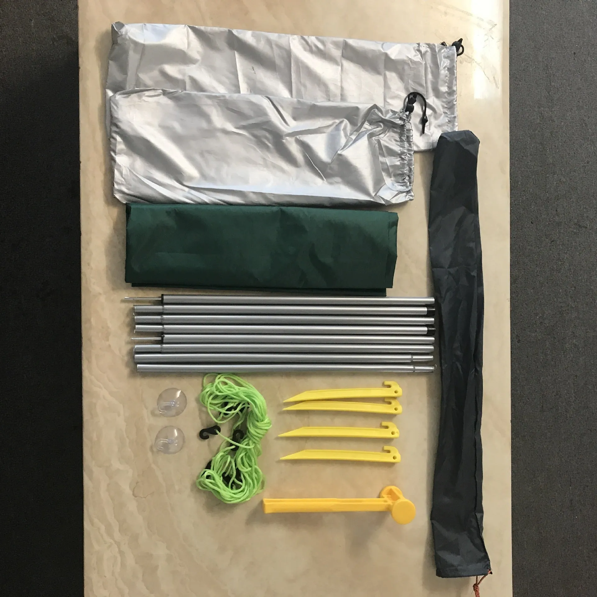 Green Unity car side awning set up next to a vehicle, showing the 2.8m x 1.8m double tent structure